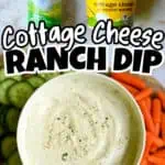 Cottage Cheese Ranch Dip with fresh vegetables and seasoning on a white plate.