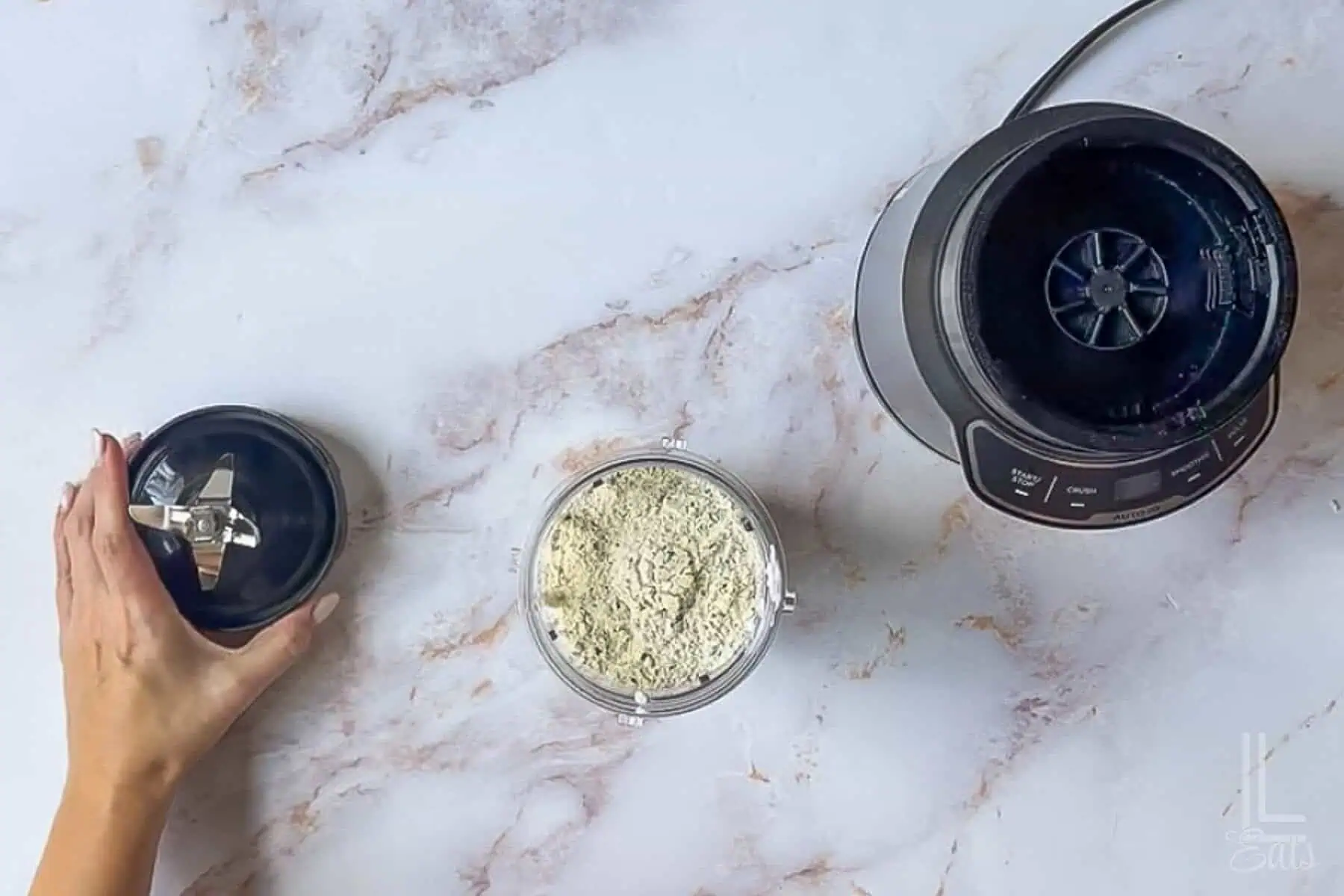 adding cottage cheese and ranch dressing mix to a blender.
