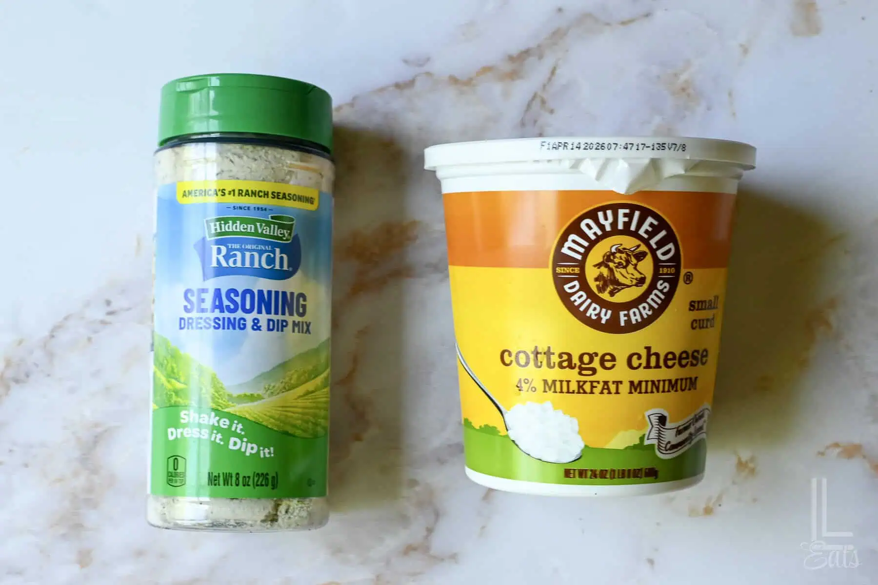 ingredients for cottage cheese ranch dip (4% milkfat cottage cheese and ranch seasoning mix).