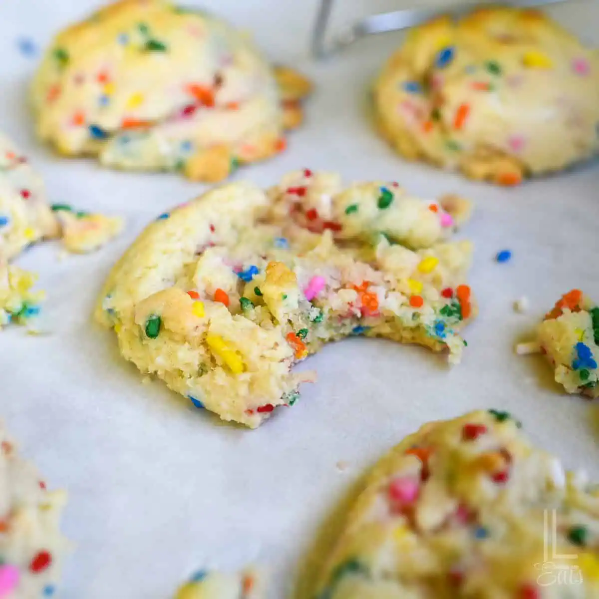 funfetti cake mix cookie with bite taken out.