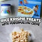Close-up of Rice Krispie Treats with marshmallow creme and ingredients on table.