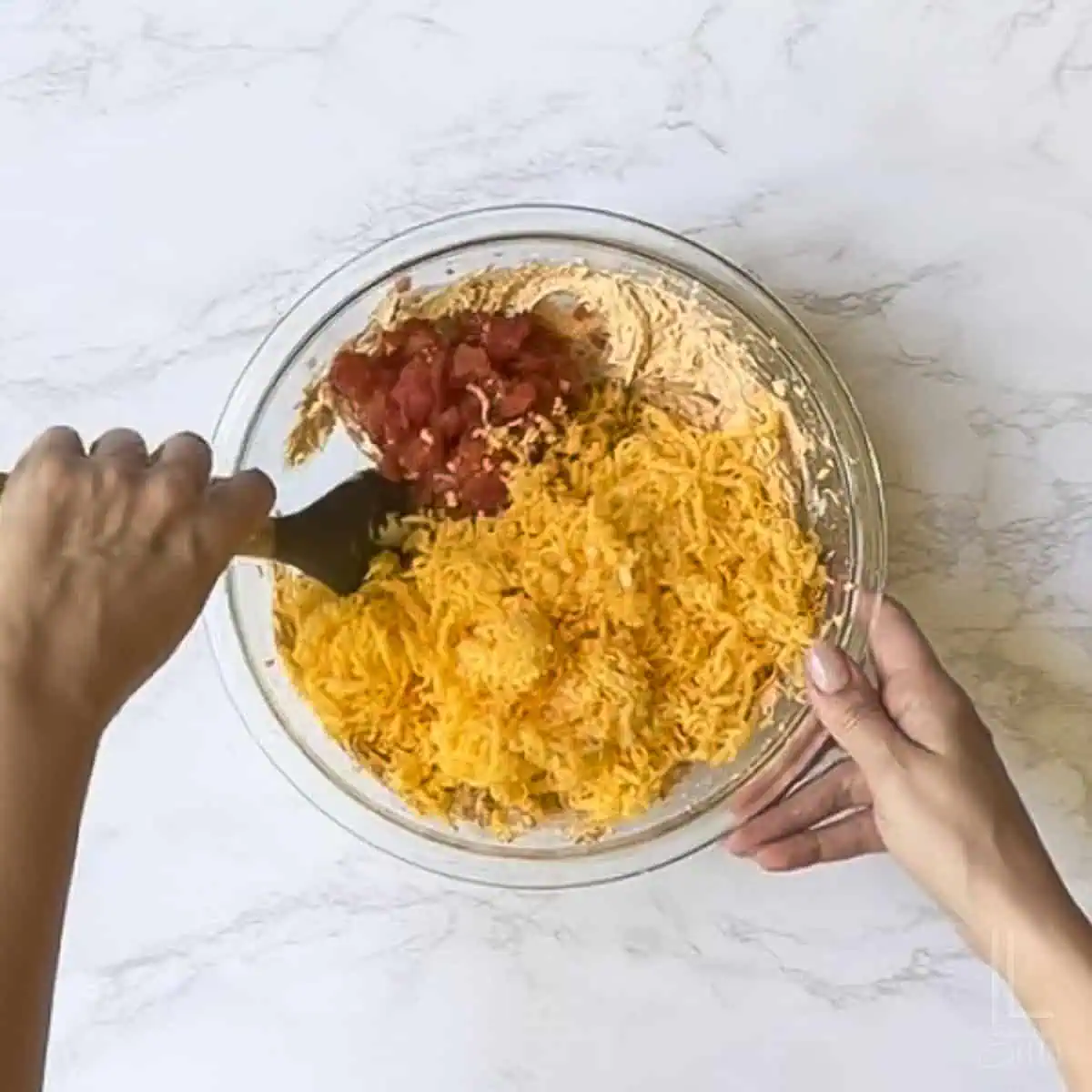 folding in shredded cheddar and drained rotel to boat dip.