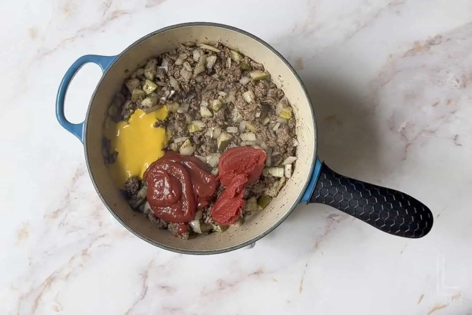 added ketchup, mustard, worcestershire sauce, and tomato paste to the ground beef mixture.