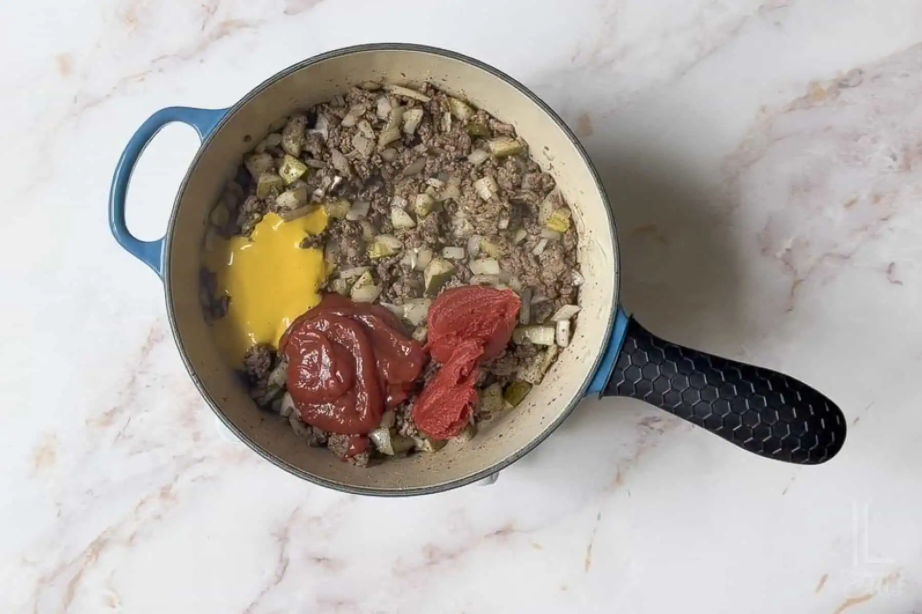 added ketchup, mustard, worcestershire sauce, and tomato paste to the ground beef mixture.