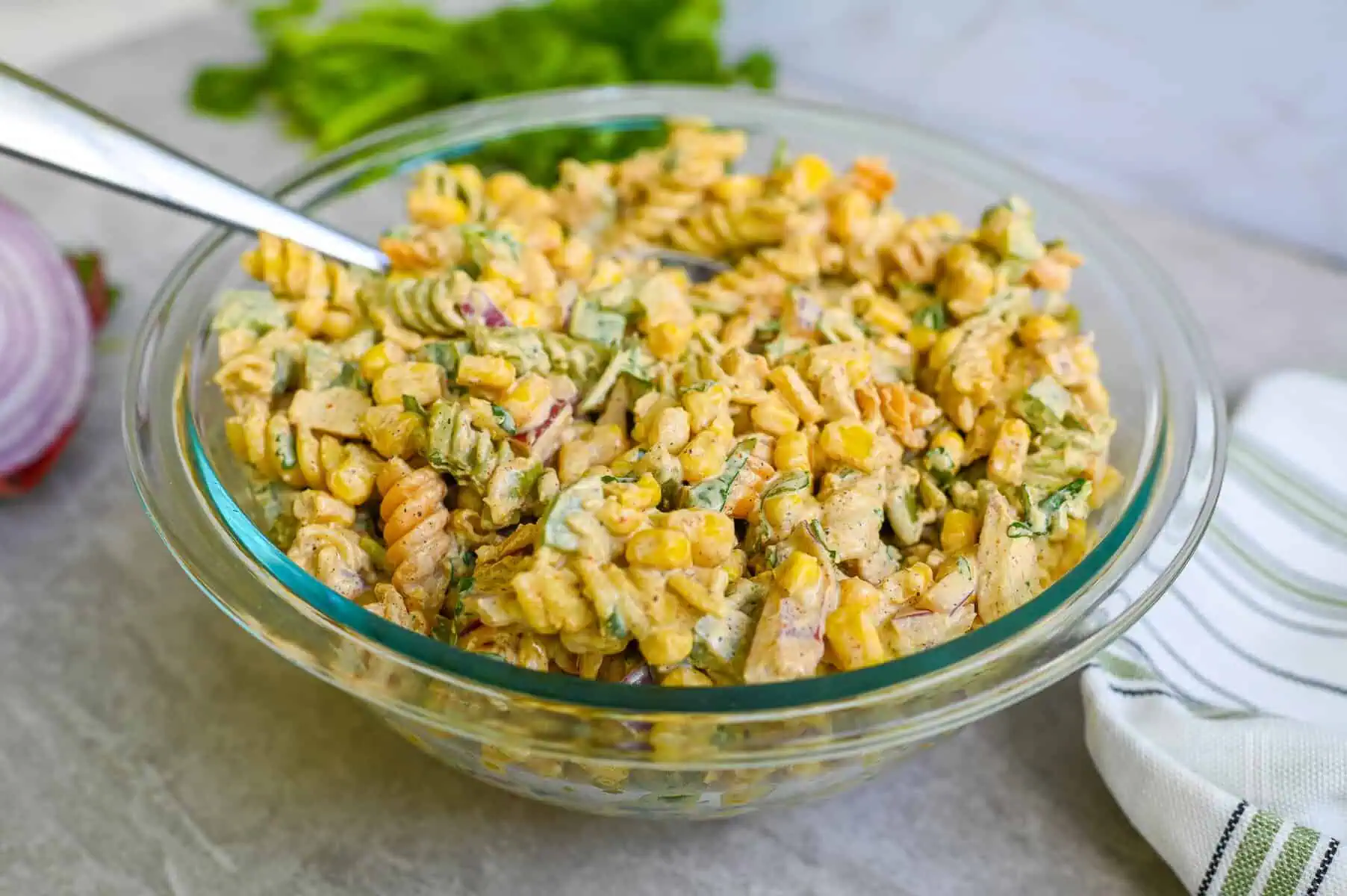 close up of elote pasta salad in a bowl.