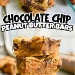 Close-up of chocolate chip peanut butter cookie bars stacked with a blurred background.