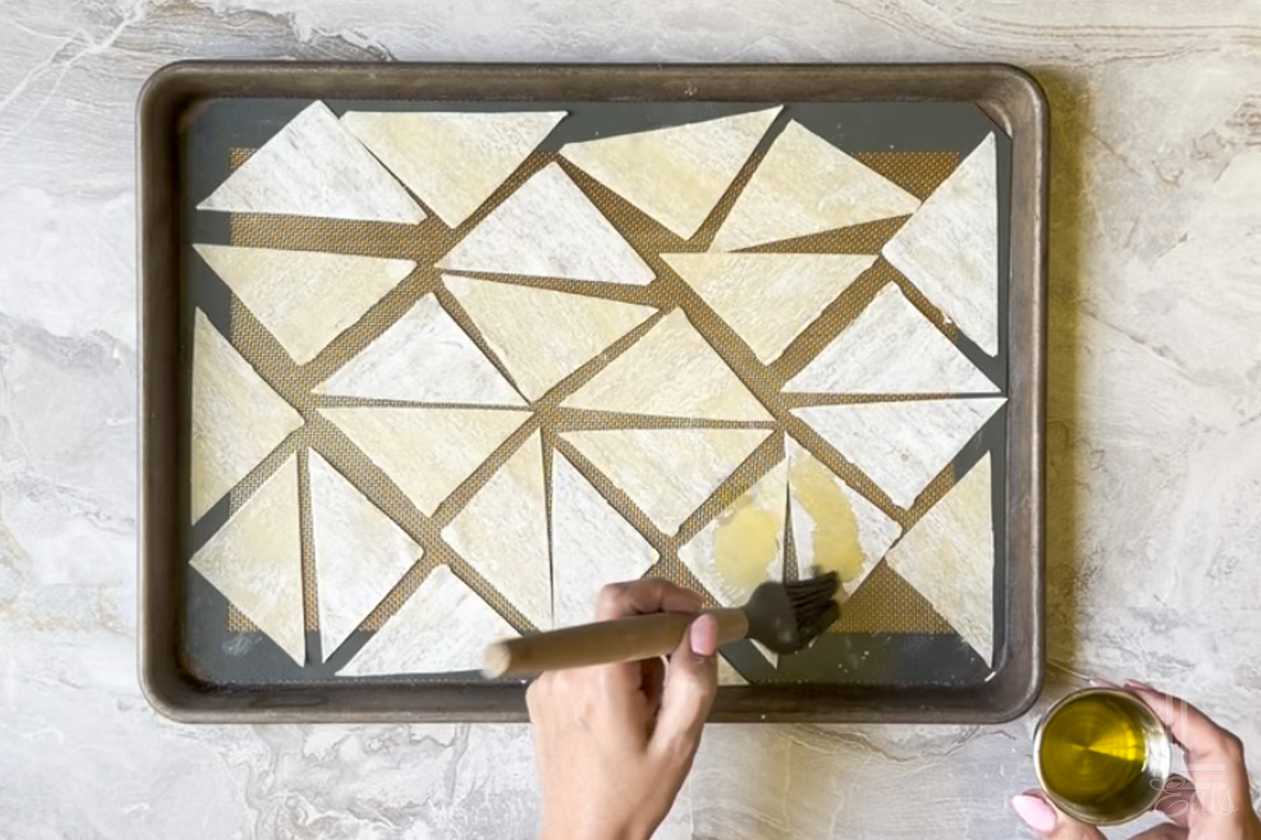 brushing olive oil on the wonton wrappers, before baking.