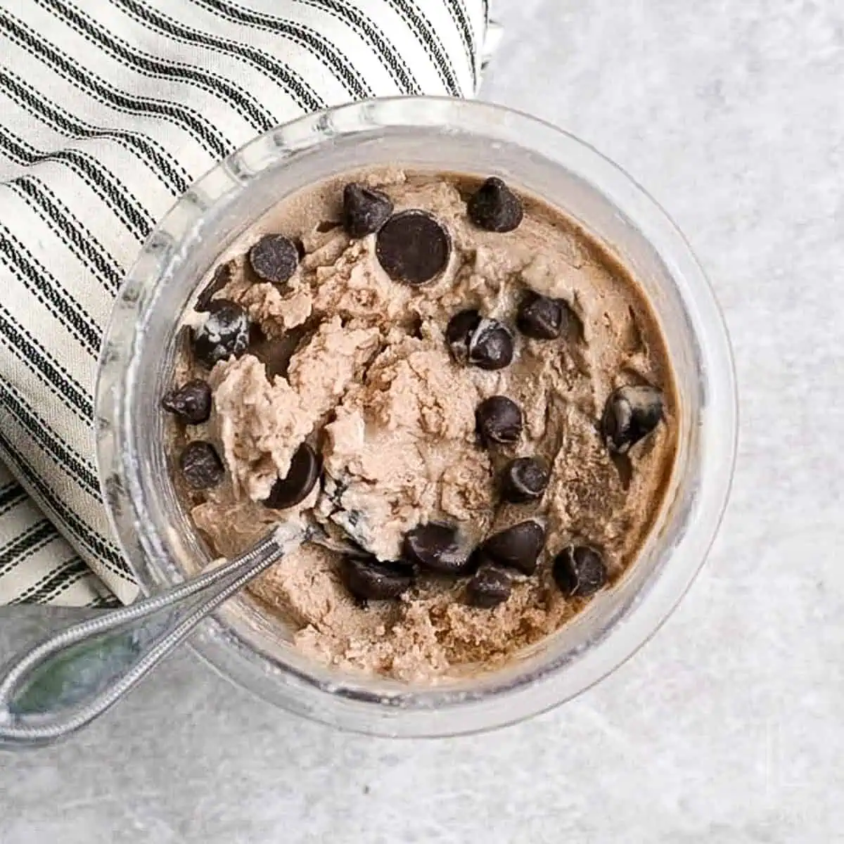 a pint of ninja creami protein ice cream topped with chocolate chips.