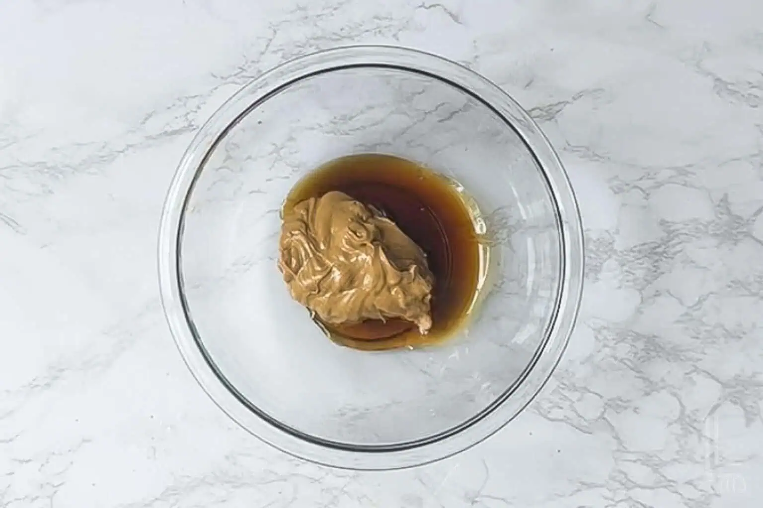 peanut butter and maple syrup in a glass bowl.