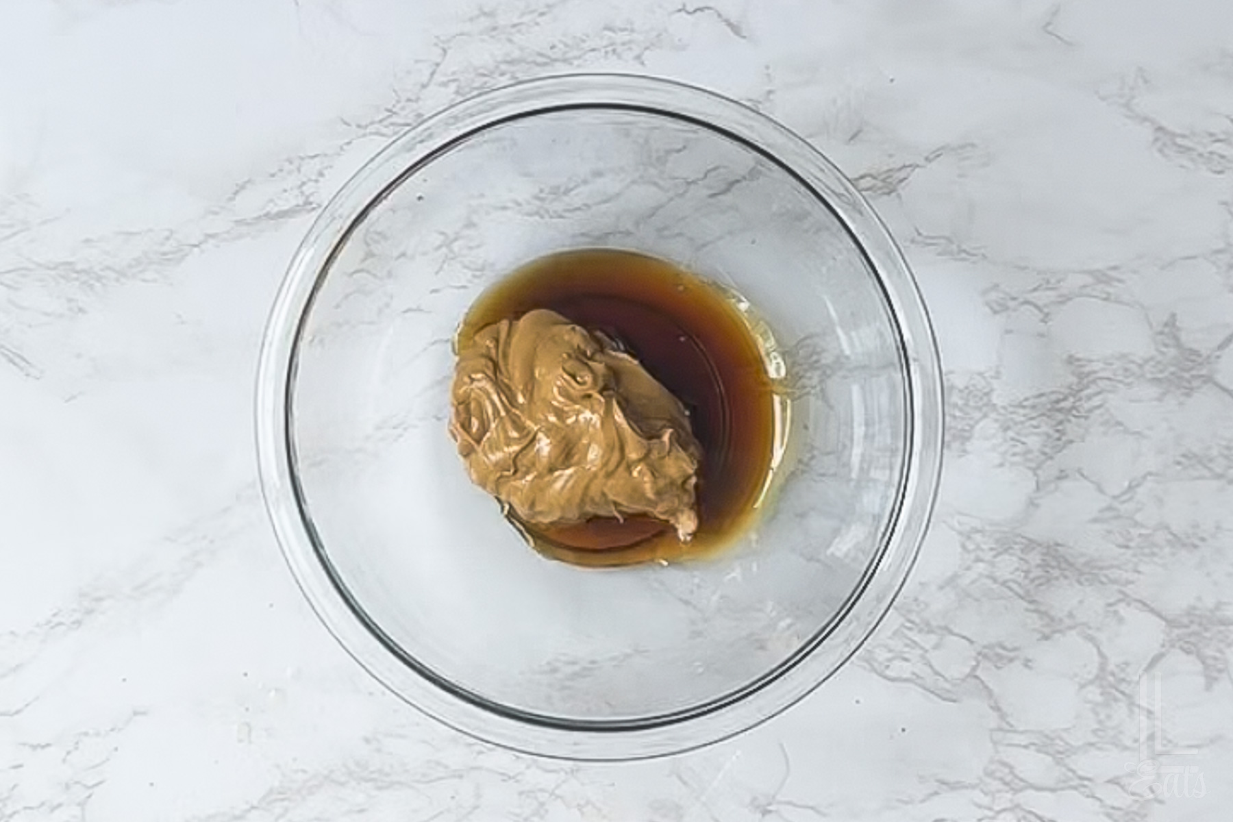 peanut butter and maple syrup in a glass bowl.