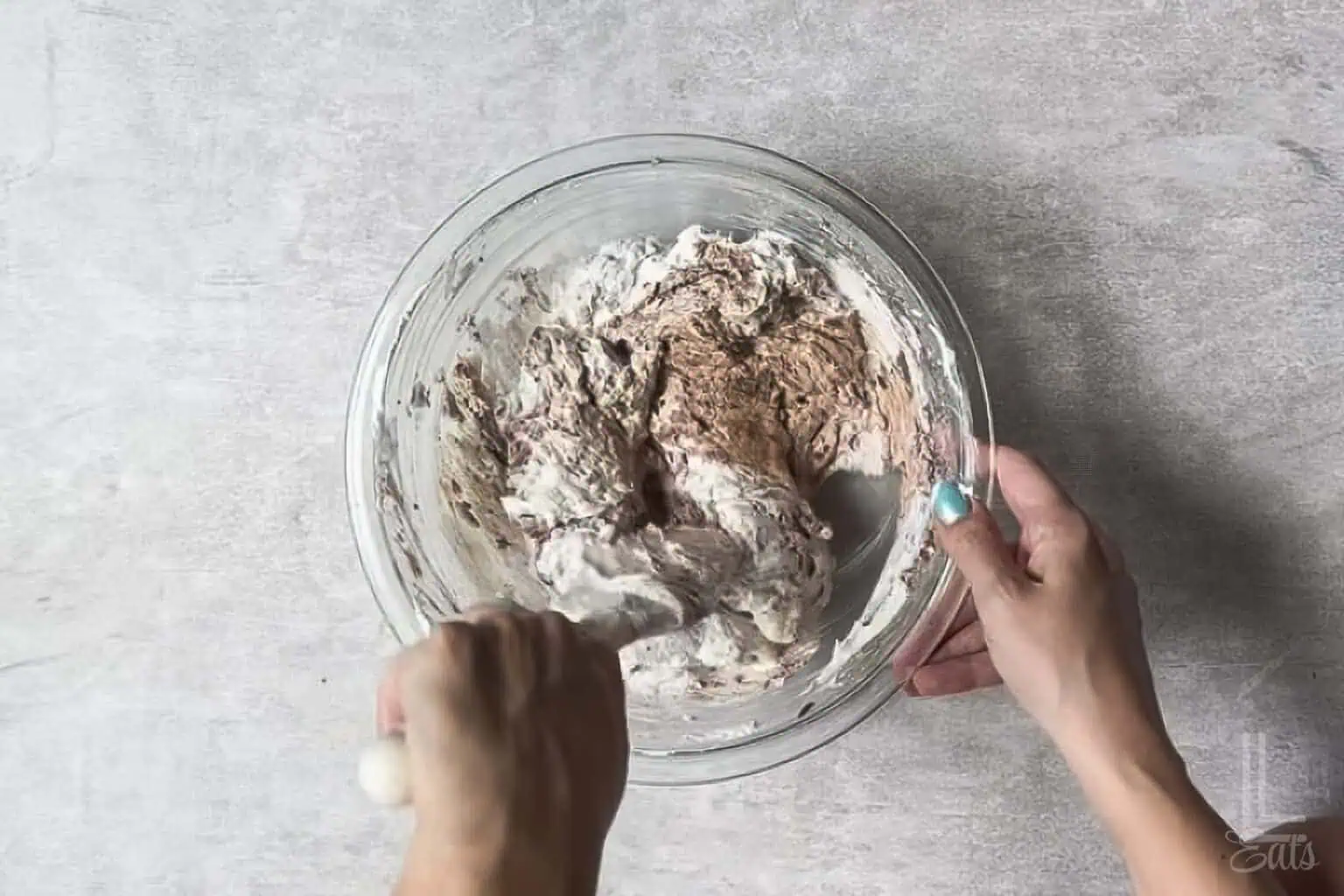 folding whipped topping into the brownie batter dip mixture.