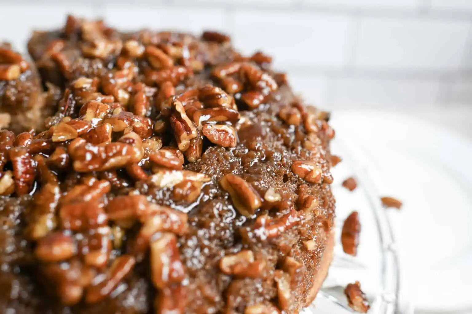 Close-up of pecan upside down cake with caramelized pecans on top.