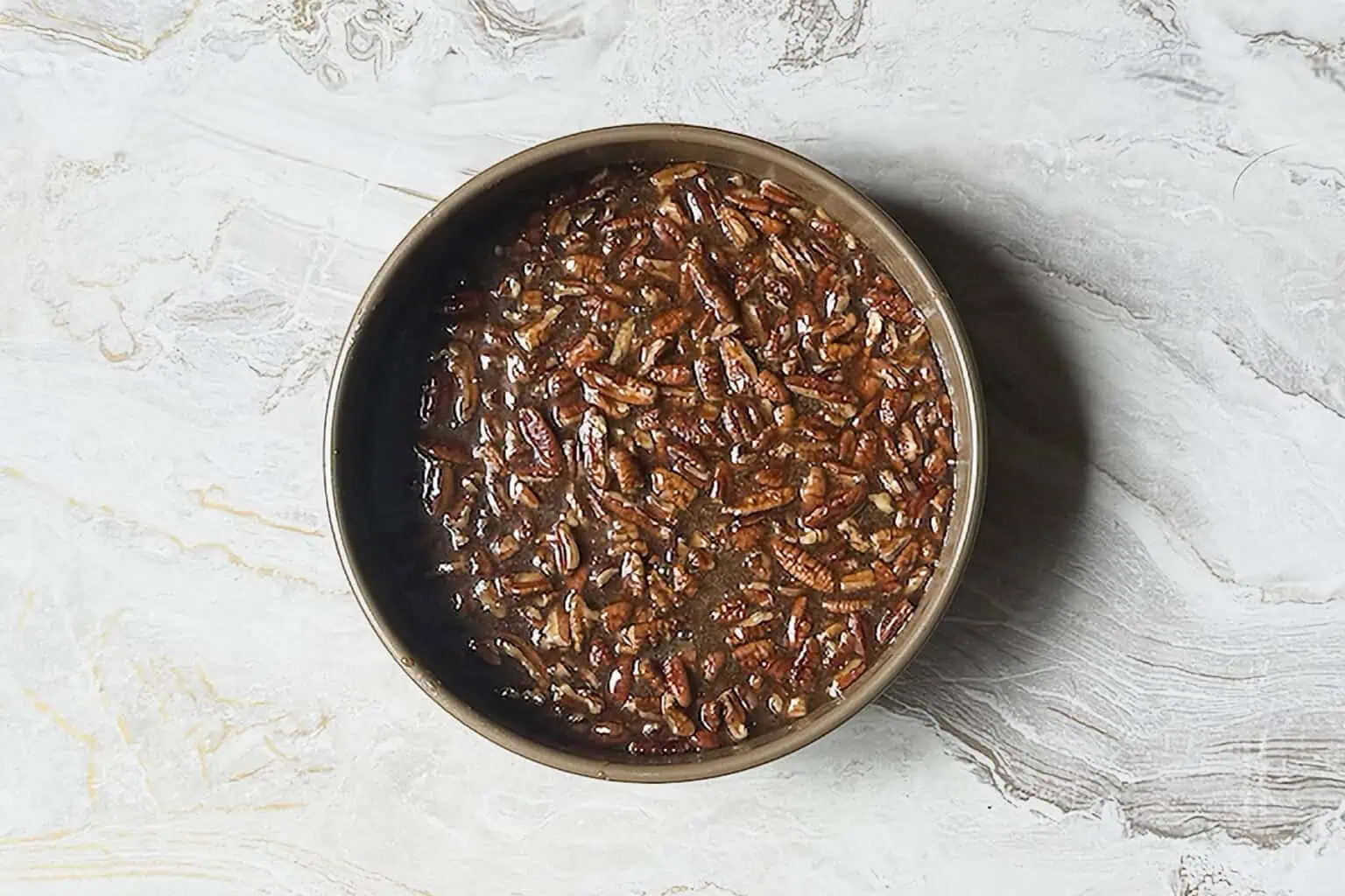 added pecans into the caramel mixture for the top of the pecan upside down cake.
