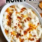 Creamy hot honey dip in a white bowl with crispy bread slices nearby.