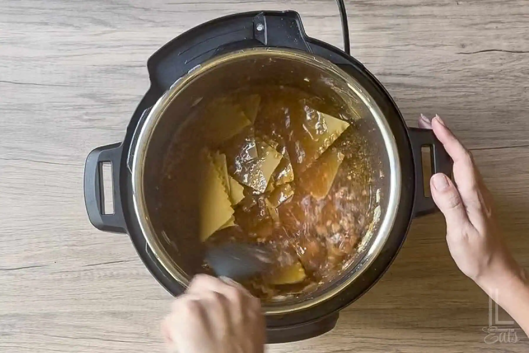 Added remaining soup ingredients, including chicken broth and lasagna noodles, to the instant pot.