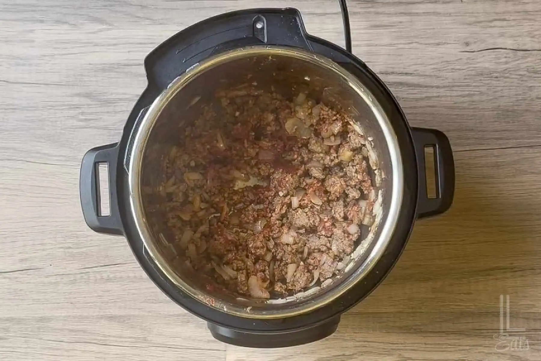 Added tomato paste to the italian sausage mixture.