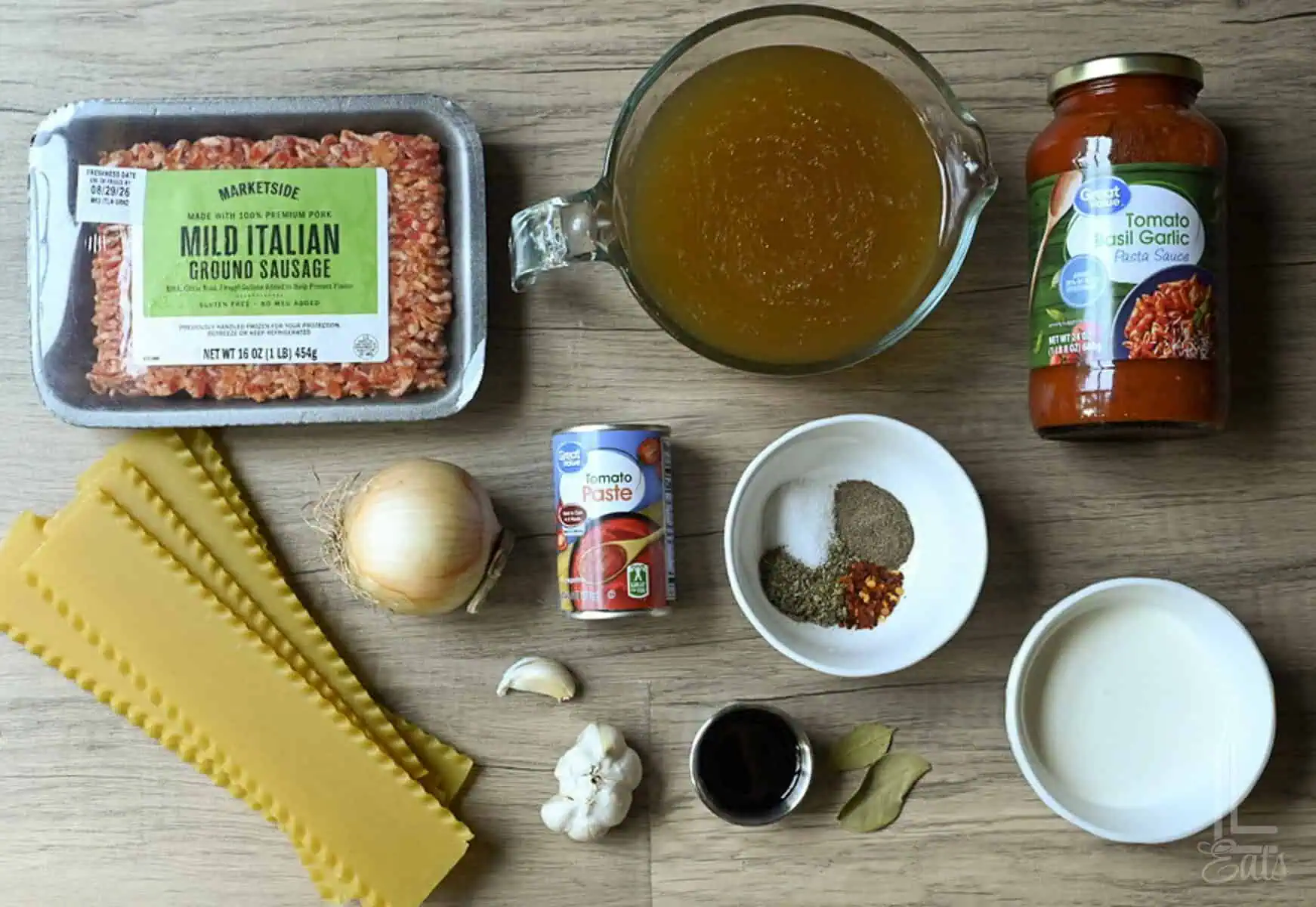 ingredients for instant pot lasagna soup, including noodles, italian sausage, ricotta cheese, and tomato sauce.