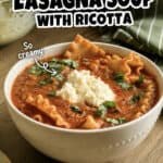Delicious Instant Pot lasagna soup with ricotta and fresh herbs in a white bowl.