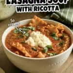 Delicious Instant Pot lasagna soup with ricotta and fresh herbs in a white bowl.