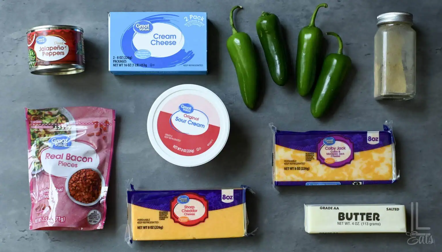 Ingredients for Jalapeño Popper Dip including cream cheese, bacon, jalapeños, and butter.