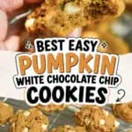 Close-up of a hand holding a pumpkin white chocolate chip cookie with more cookies on a cooling rack.