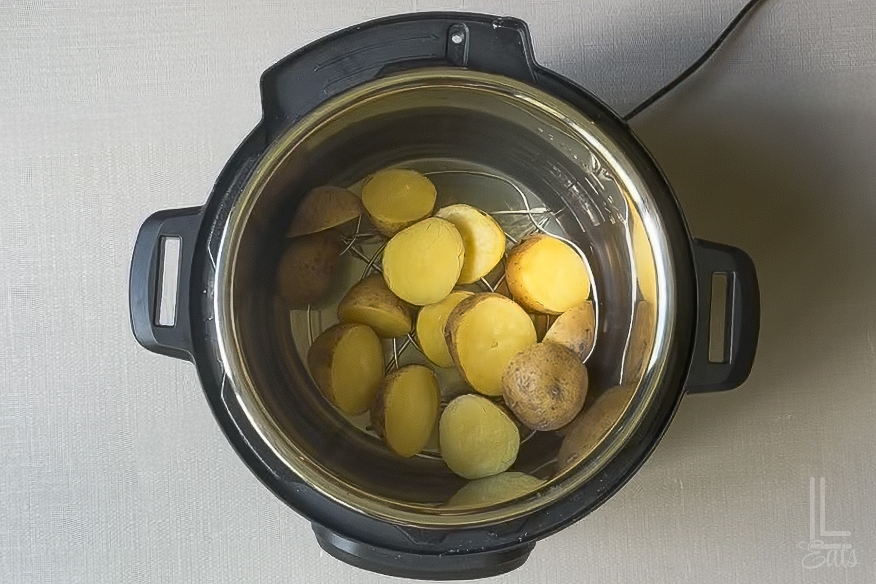 Chopped potatoes in an Instant Pot before pressure cooking.