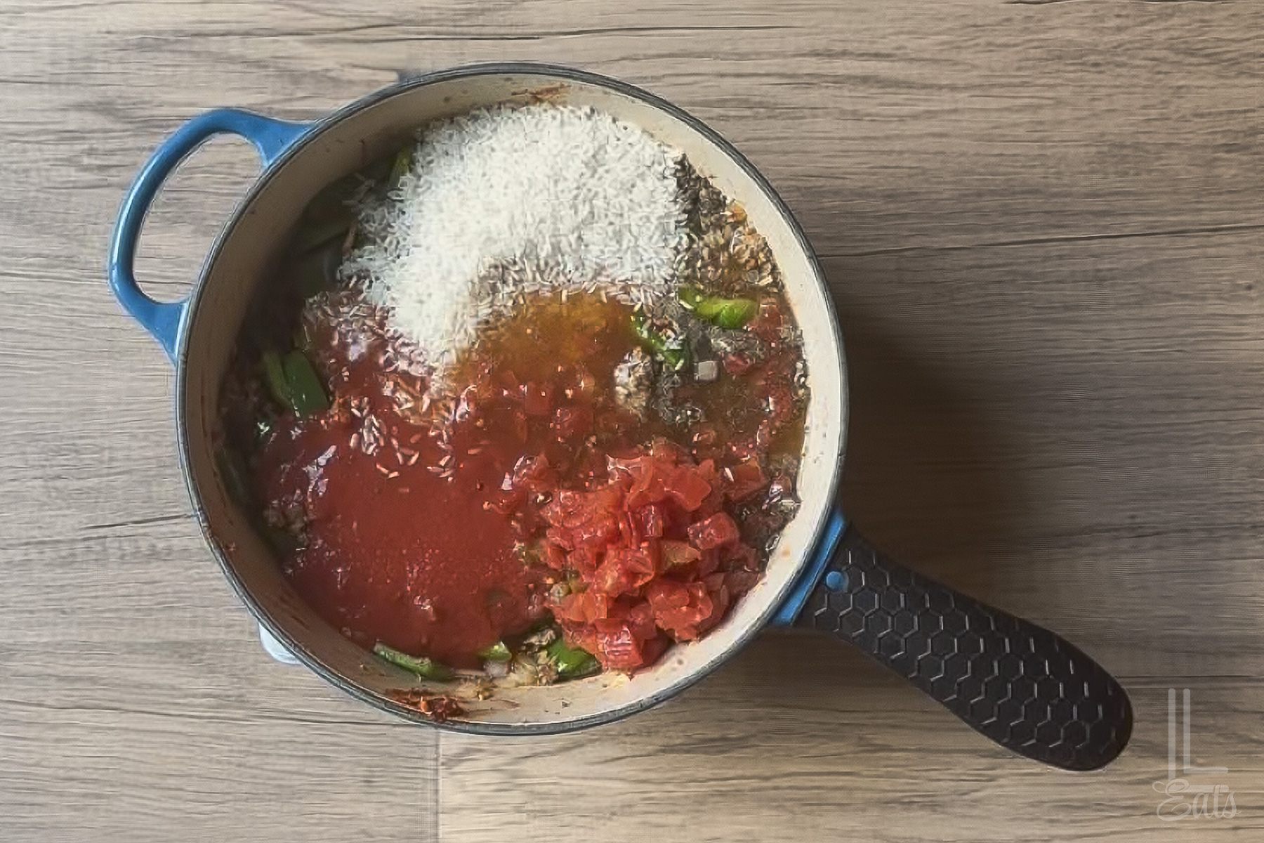 Added the rest of the deconstructed stuffed peppers ingredients (rice, tomatoes, broth).