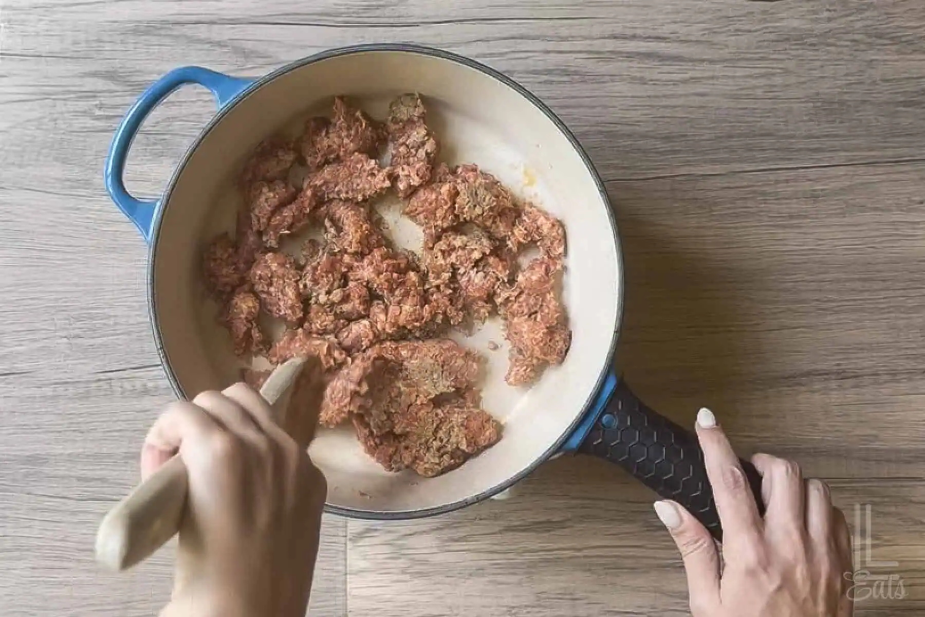 Browning sausage in a large skillet.