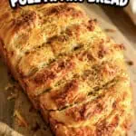 Cheesy garlic pull apart bread with golden crust and melted cheese.