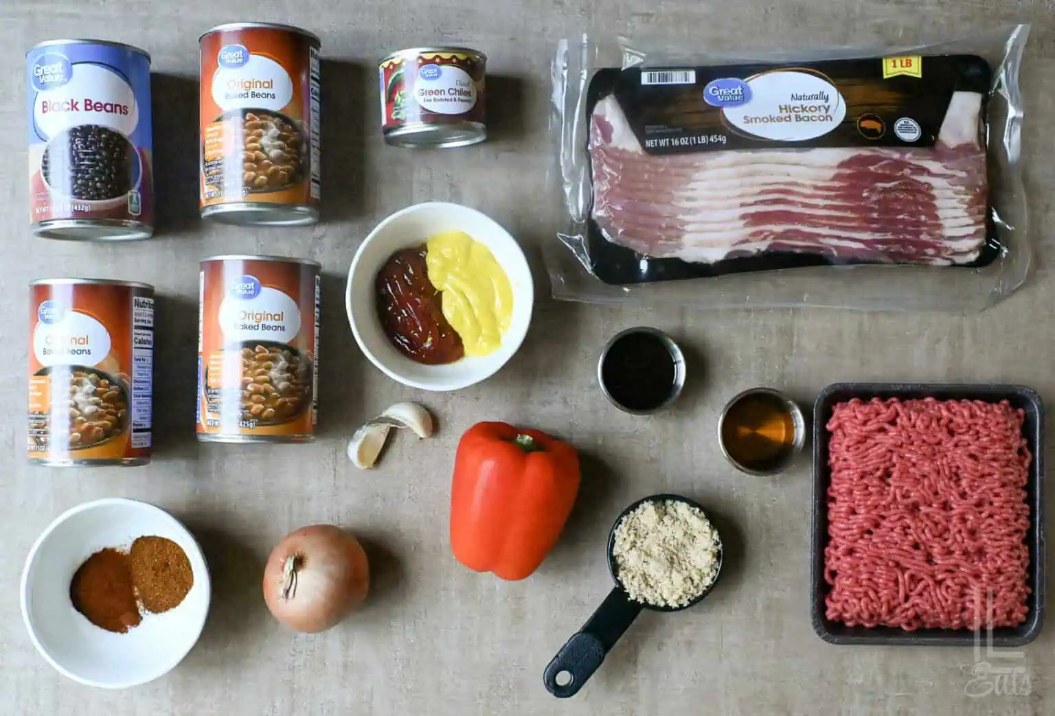 Ingredients for Cowboy Baked Beans with bacon, ground beef, and spices.