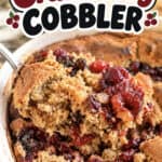Holiday cranberry cobbler with fresh berries and golden crust in a baking dish.
