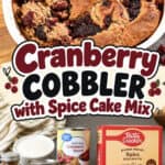 Freshly baked cranberry cobbler with spice cake mix in a white dish, ready to serve.