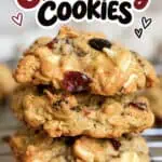 Close-up of oatmeal cranberry cookies with white chocolate on a cooling rack.
