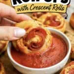 Close-up of pizza roll ups with crescent rolls and dipping marinara sauce.